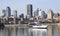 Montreal skyline and cruise boat reflected into Saint Lawrence River, Canada