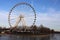 Montreal tourism - ferris wheel, details, on blue sky background. Amusement park, festive mood. viewpoint