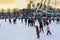 Montreal tourism - winter skating rink near the Ferris wheel. People are skating in the winter against the background