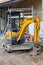 Montreux,switzerland-October 23,2019: The yellow mini  backhoe stop in Construction site