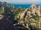 Montserrat, Catalonia, Spain. Top View Of Hillside Cave Santa Cova De Montserrat Or Holy Cave Of Montserrat In Summer