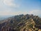 Montserrat, Catalonia, Spain. Top View Of Hillside Cave Santa Cova De Montserrat Or Holy Cave Of Montserrat In Summer