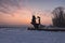 Monument of the Founders of Kyiv, at the bank of River Dnipro. Sunrise at a frosty winter morning. Wide-angle view cityscape.