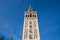 Monument of the giralda of seville in the gothic cathedral. It can be seen rising into the blue sky of the city. It is the largest