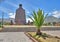 Monument of the Middle of the World and palm trees