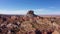 Monument Rock Massive Of Red Orange Cliffs In Desert Western Usa Aerial View