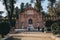 Monument to Catalina de Ribera in Jardines de Murillo, Seville, people walking past, motion blur
