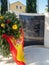 Monument to fallen Spanish soldiers with a Spanish flag and some flowers