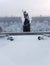 Monument to the Heroic Komsomol- bronze sculpture of a young Red Army man under falling snow in St. Petersburg, Russia. Focus on f