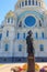 Monument to russian admiral Fyodor Ushakov in front of the Naval cathedral of St. Nicholas in Kronstadt, Russia