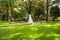 The monument to Sissi is hidden by greenery along the Promenade of Merano Meran, next to the post bridge. South Tyrol, Italy