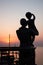 Monument to the wife of a sailor with a child in her arms, who are waiting for her husband in the early morning, dawn in Odessa.