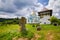 Monument and tombstone in a yard of ruined castle to a warrior hero of Bohdan Khmelnytsky rebellion