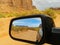 Monument Valley landscape in rear vision mirror