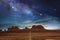 The monument valley under a night starry sky