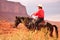 Monument Valley , Utah - September 12: Monument Valley Tribal Park in Utah USA on September 12, 2011. Cowboy on horse in famous tr