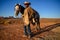 Monument Valley, Utah, USA, November 3rd, 2019, Native Navajo wearing traditional American cowboy with horses