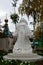 Monument of a woman from white solid granite