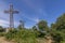 The monumental cross overlooking the summit of Monte Argentario, Tuscany, Italy, on a sunny day