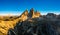Monumental jagged peaks of Tre Cime di Lavaredo at sunrise