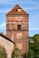 monumental medieval defensive walls and historic brick building in the city of Torun