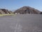 Monumental pyramid of the Moon at Teotihuacan ruins seen from Avenue of the Dead near Mexico city landscape