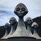 Monumental sculpture of brave aliens. AI-generated.