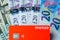 Monzo bank card on the dollar, pound, euro banknotes background. Illustrative concept of multi currency account `all in one