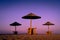 Moody chilling peaceful beach and sea view with sunshades at sunset chillout color split toning