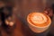 Moody coffee background, latte art on wooden table