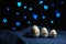 Moody easter banner concept. Wooden eggs different sizes with natural rope decoration on blue fabric on black background with