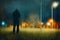 A moody hooded figure, back to camera. Standing on the edge of a town, surrounded by street lights. With a grunge, blurred edit