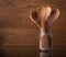 Moody image of wooden spoons in a glass jar