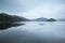 Moody landscape image of lake pre-dawn in Autumn with haunting f