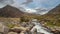 Moody landscape image of river flowing down mountain range near Llyn Ogwen and Llyn Idwal in Snowdonia in Autumn