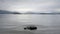 Moody loch lake atmospheric grey clouds dark water Lomond Scotland highlands landscape scene outdoors