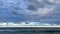 moody ocean coastline scene with beautiful cloud scape