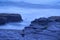 Moody Ocean Seascape landscape on rocky beach