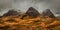 A moody panoramic of the Three Sisters mountains in Glencoe. Scotland