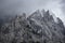 Moody picture of Cadin di Misurina mountains, covered in clouds in bad weather. Cortina d`Ampezzo, Italy