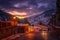 Moody road with illuminated street lights in El Tarter village at night in Pyrenees, Andorra