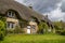 Moody skies above a thatched cottage in Dorset, England.