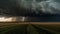 Moody sky over wheat fields with lightning generated by AI