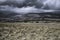 Moody sky with rainclouds over beautiful mountain valley in Lake District, UK