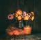 Moody Still Life with Colorful Flowers in a Jug