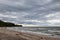 Moody stormy gray clouds over the sandy beachfront shore of Lake Erie at Wendt Beach Park, New York, USA