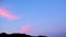Moody sunrise burning sky timelapse over mountain silhouette,red clouds motion