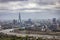 Moody view of the London skyline with lifted up Tower Bridge