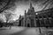 A moody wide angle black and white photograph of the Nidaros Cathedral in Norway