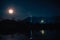 The moon and Big Buddha, The moon over Wat Khao Wong Phra Chan temple and the mountain at Lopburi Thailand